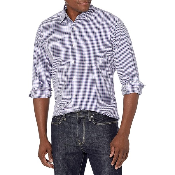 a man wearing a poplin style shirt and denim jeans