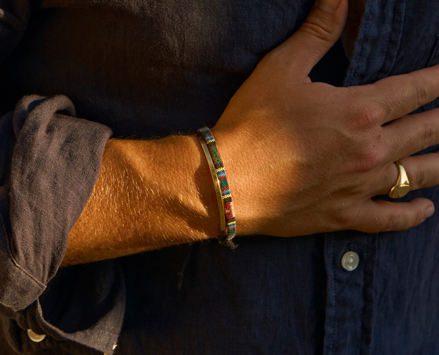 fabric bracelet next to a cuff