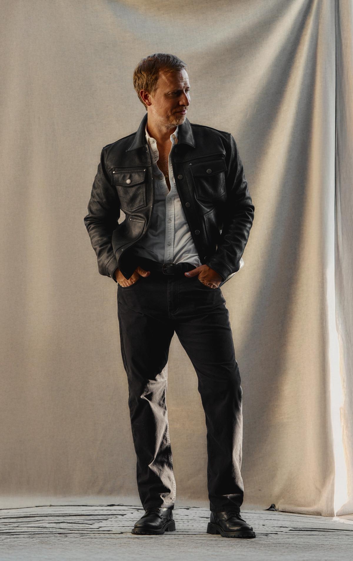 fall outfit with black leather jacket, white oxford shirt, black pants, and black boots, men's fall style ideas