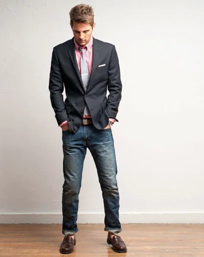 jcrew photo showing blazer, tie, pink hirt, slim cuffed jeans and loafers with no socks