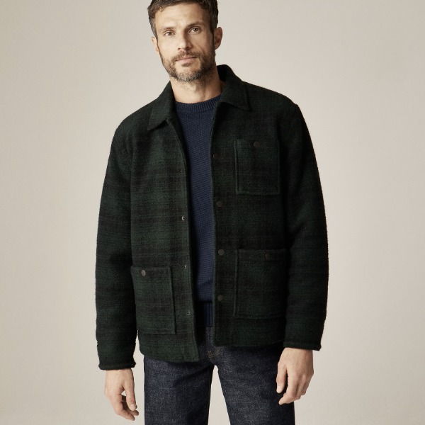 man wearing a wool blend sherpa jacket over a shirt and pants