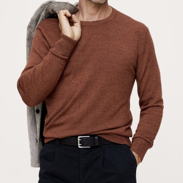 man wearing a Merino crew neck sweater with pants