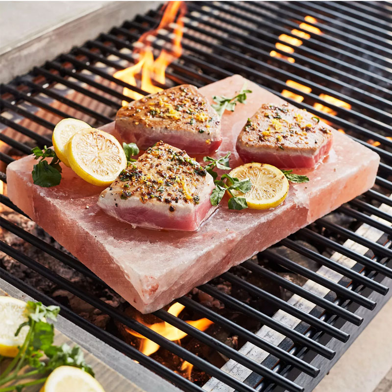 Himalayan Salt Block with assorted food items on a grill