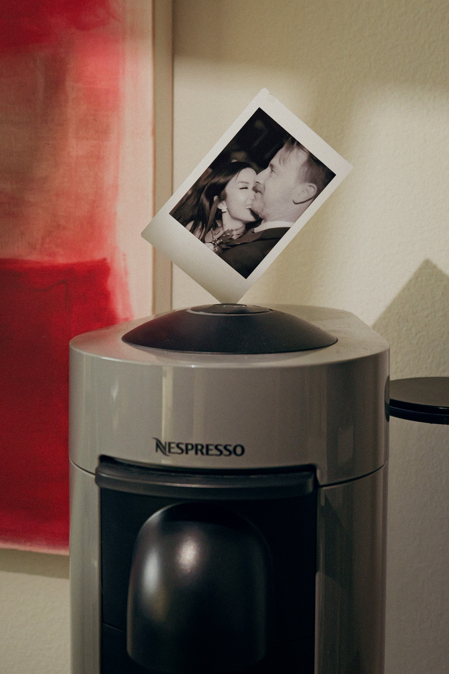 an instax photo sitting on a nespresso coffee maker for valentines day