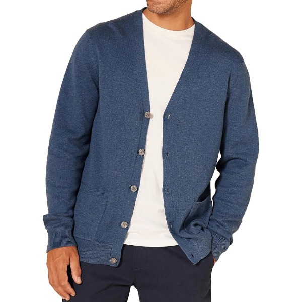 man wearing a v neck cardigan sweater with a crew neck shirt and casual pants