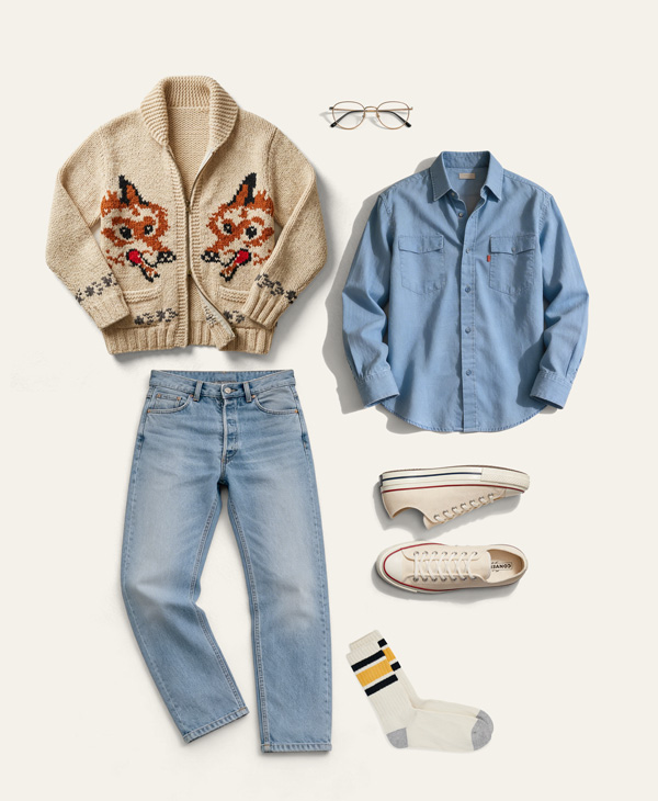 flat lay of hail mary fox sweater outfit with chambray shirt, jeans, converse, socks and glasses