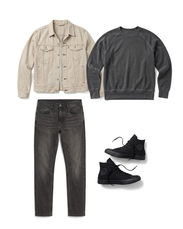 Men's casual outfit with a beige trucker jacket, charcoal sweatshirt, black jeans, and black high-top sneakers.