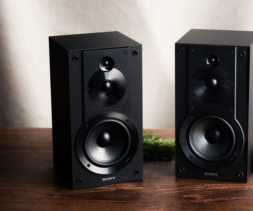 Sony SS-CS5M2 3-way bookshelf speakers in black on a wood surface