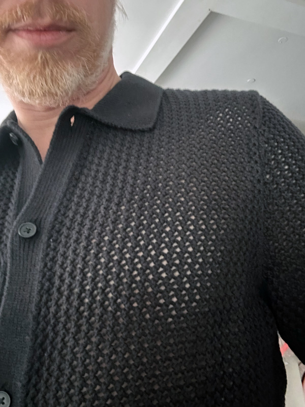 skin through an open knit shirt