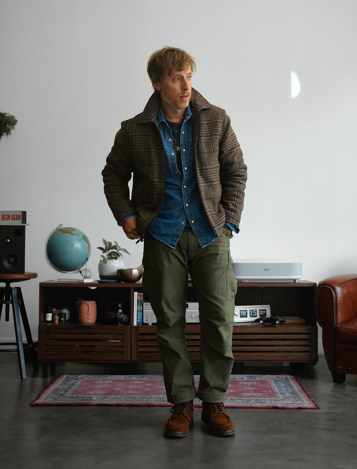 Full length outfit: olive cargo pants with the Station Jacket, denim shirt and brown moc toe boots
