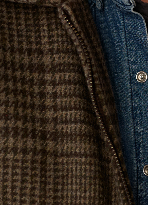 Close view of the brown glen plaid wool and metal zipper on the Station Jacket